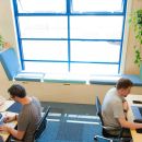 Alistair and Rob at their desks in the new studio