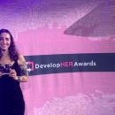 Elle accepting her award at the DevelopHER awards ceremony