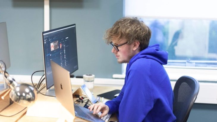 Rhys working at his computer