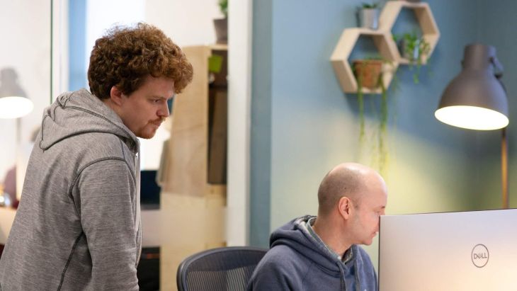 Alistair and Nick looking at a screen together