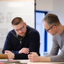 Josh and James working together on an R&D Project at the standing desk