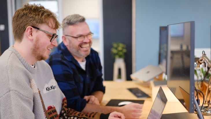 Rhys and Steve laughing as they work together