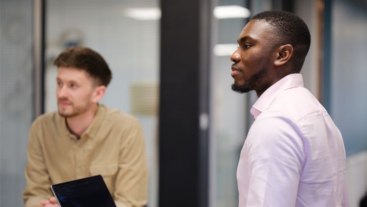 Seun and Jonny thinking during a conversation about accessibility