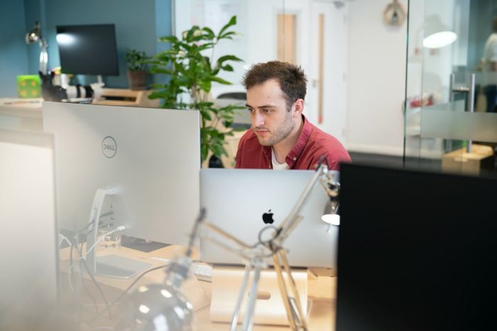 Jotham Oakley working at his desk