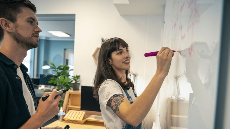 Elle and Jonny at a whiteboard app design