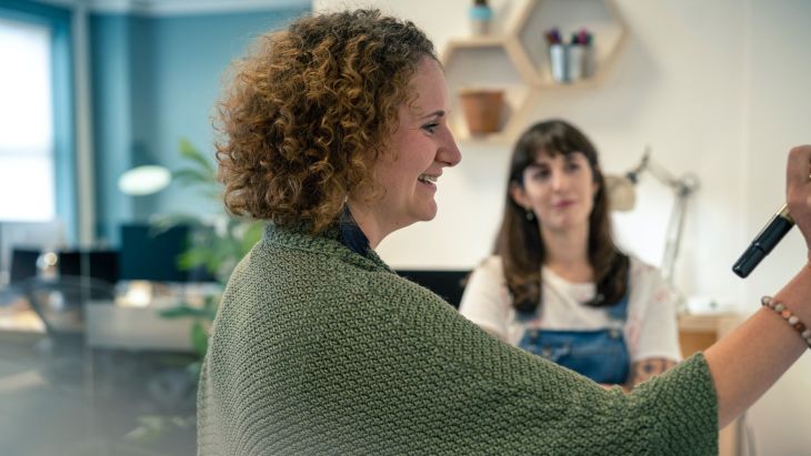 Caz and Elle taking part in a standup in the Brightec office