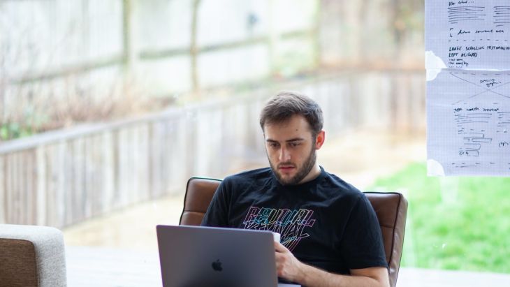 Jotham working at his laptop