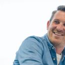 Andy smiling during a meeting