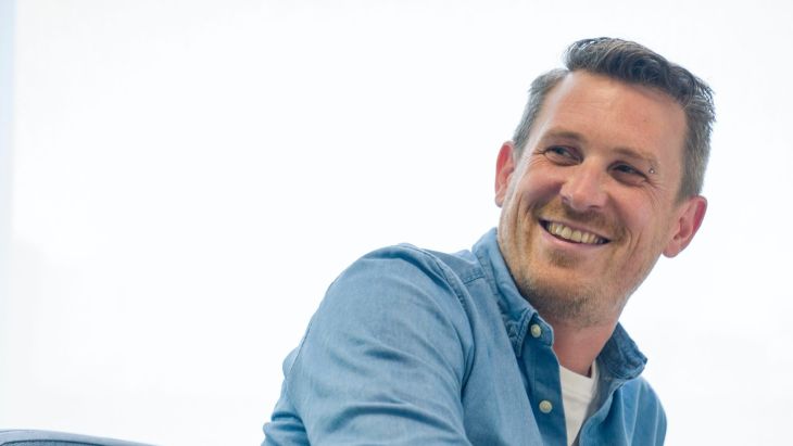 Andy smiling during a meeting