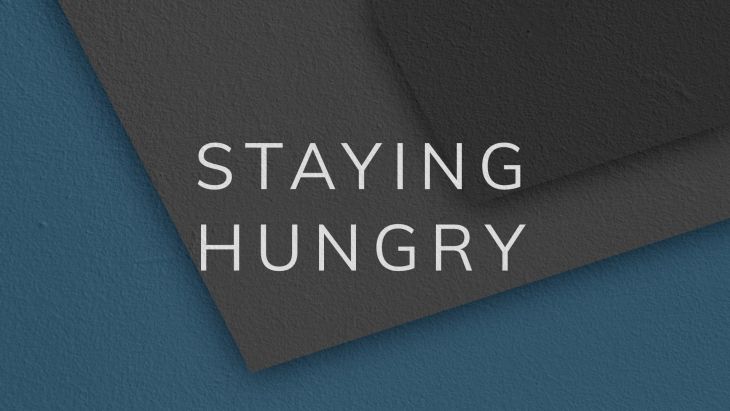 Illustration behind the words 'Staying Hungry'