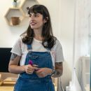 Elle using a whiteboard to consider feedback
