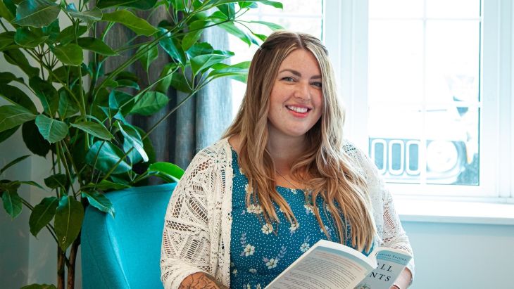 Georgia, Head of Operations, with a book