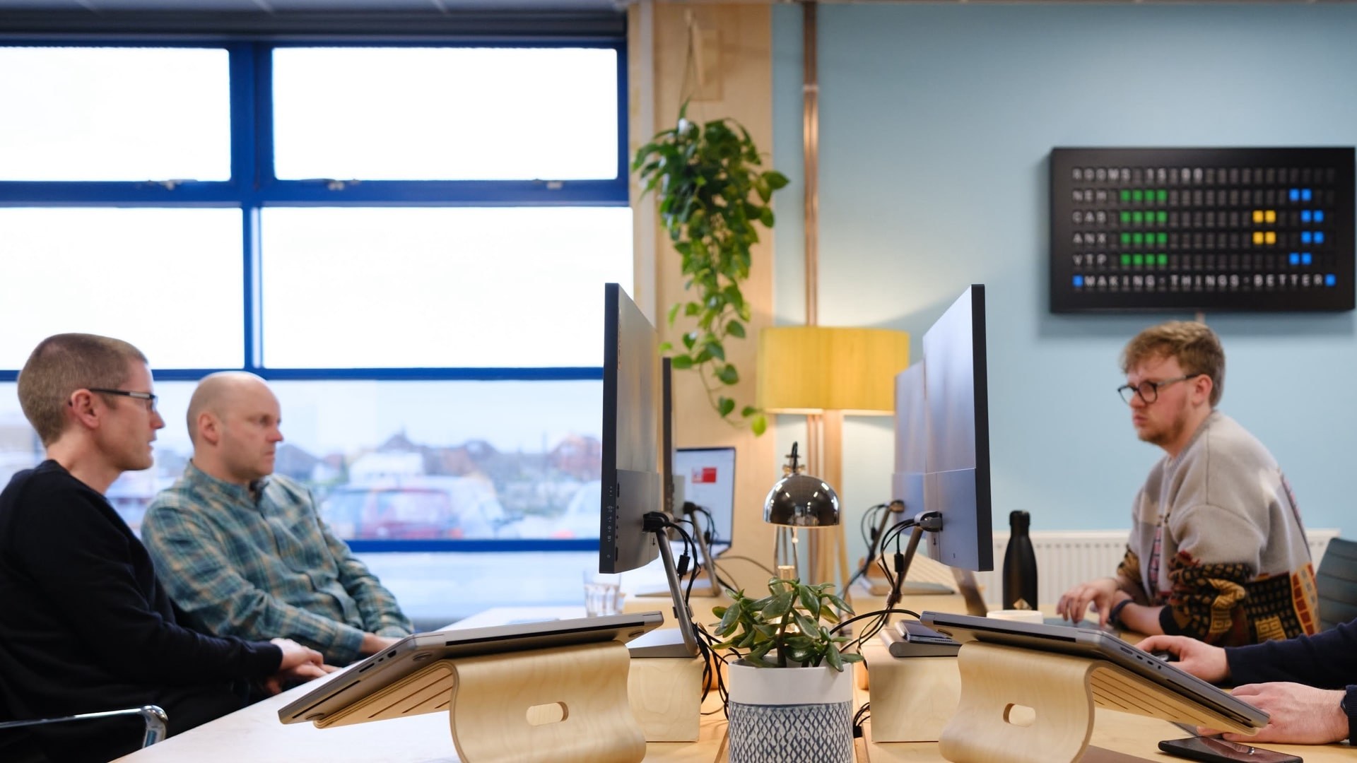 A view of plants and a well lit studio office