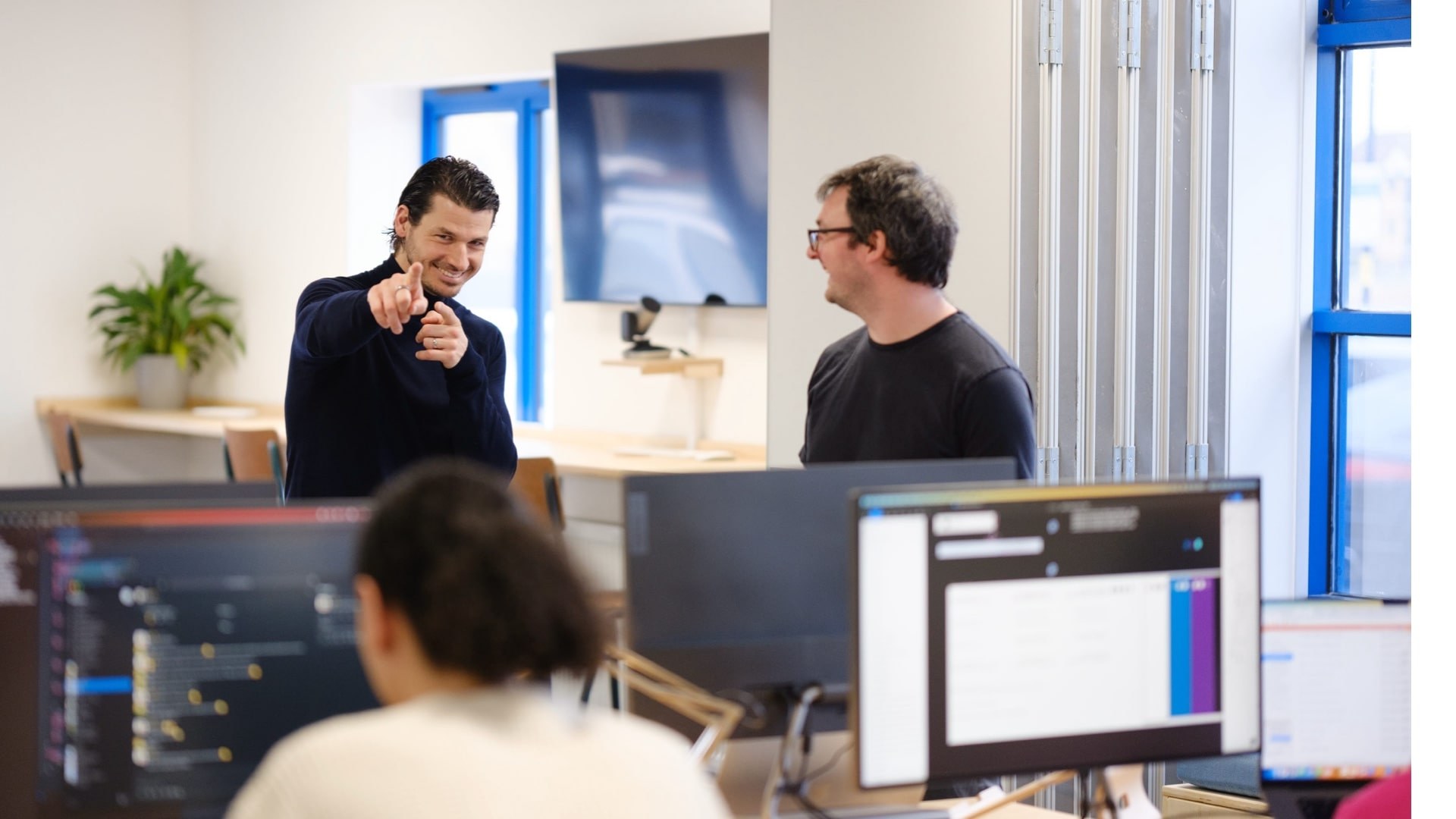 Simon points at the camera in the Brightec studio