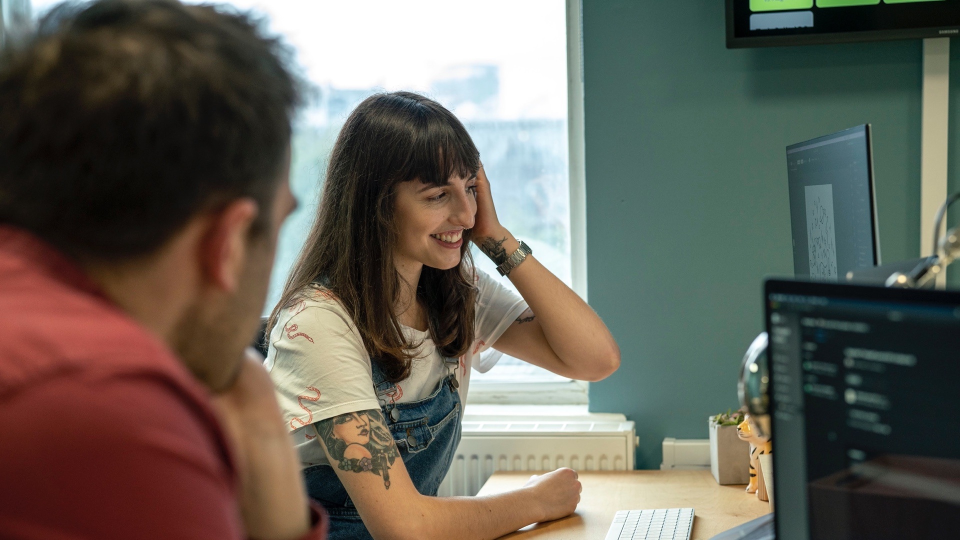 Jotham and Elle working together at a desk