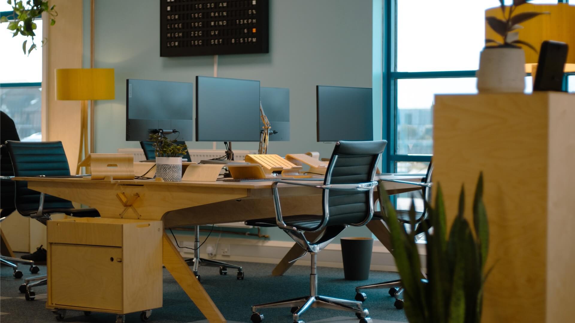 The desks, chairs and Vestaboard in-situ